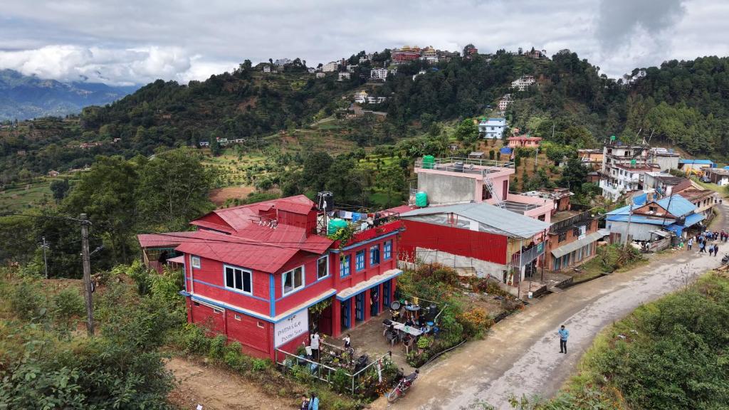 a red building on top of a mountain at Namaste Home Stay in Dhulikhel