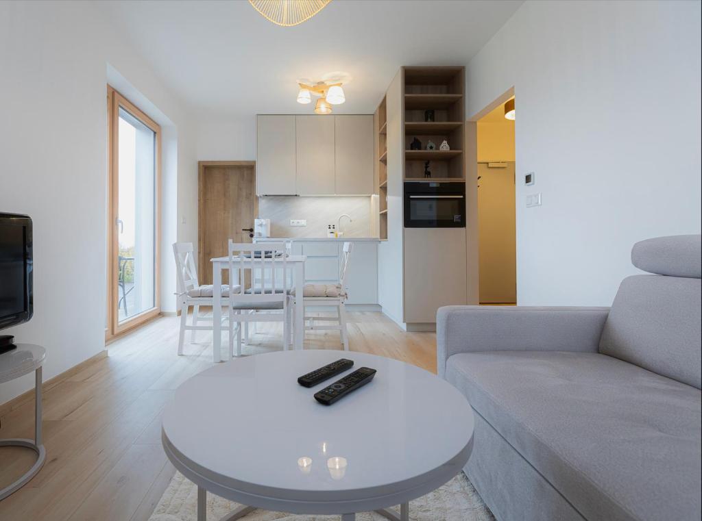 a living room with a couch and a table at Môj Hillside in Dolný Kubín
