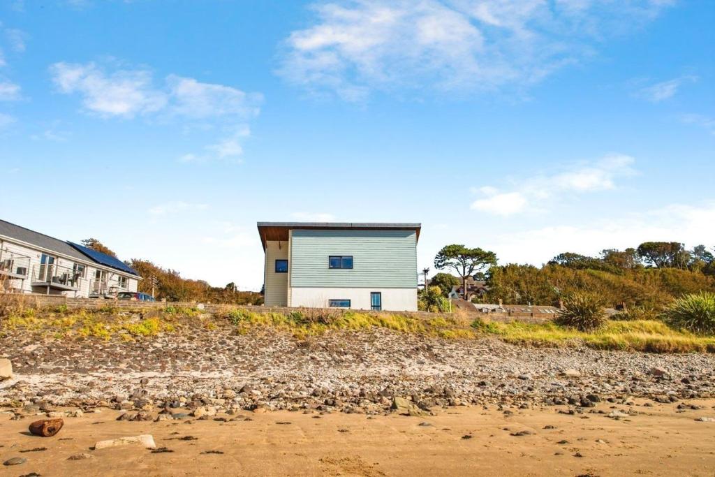 a house on the shore of a beach at Beachside in Ferryside