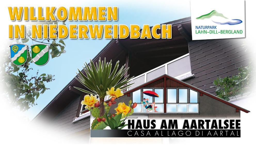 a magazine cover with a house with flowers on it at Haus am Aartalsee in Bischoffen