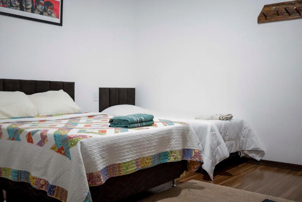 Ένα ή περισσότερα κρεβάτια σε δωμάτιο στο Casa Manacah - casa em Tiradentes