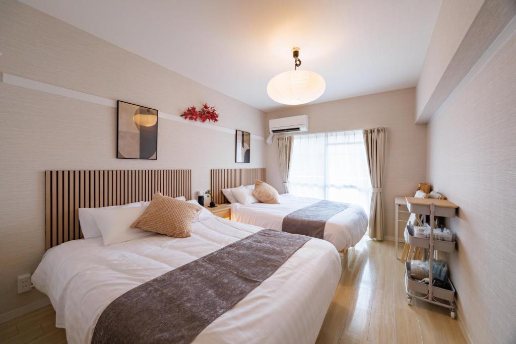 Postel nebo postele na pokoji v ubytování Nagoya15min-Nagoya Castle-Free P