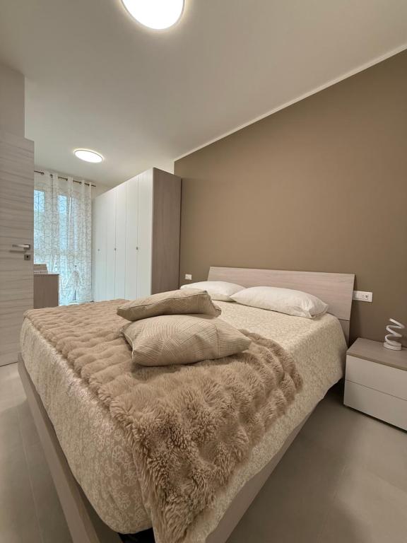 Ένα ή περισσότερα κρεβάτια σε δωμάτιο στο soffio del mar