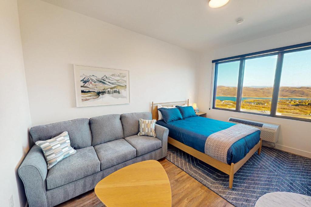 a living room with a couch and a bed at Pioche Village - #1230 in Cranmer