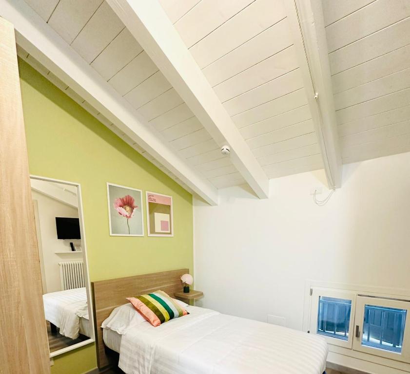 Postel nebo postele na pokoji v ubytování Giardini B&B