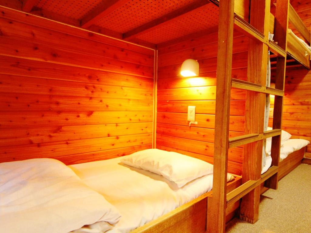 Postel nebo postele na pokoji v ubytování Ullr