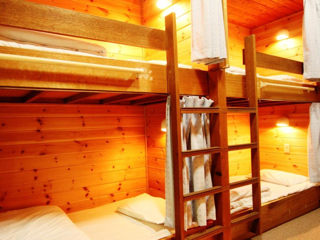 Postel nebo postele na pokoji v ubytování Ullr