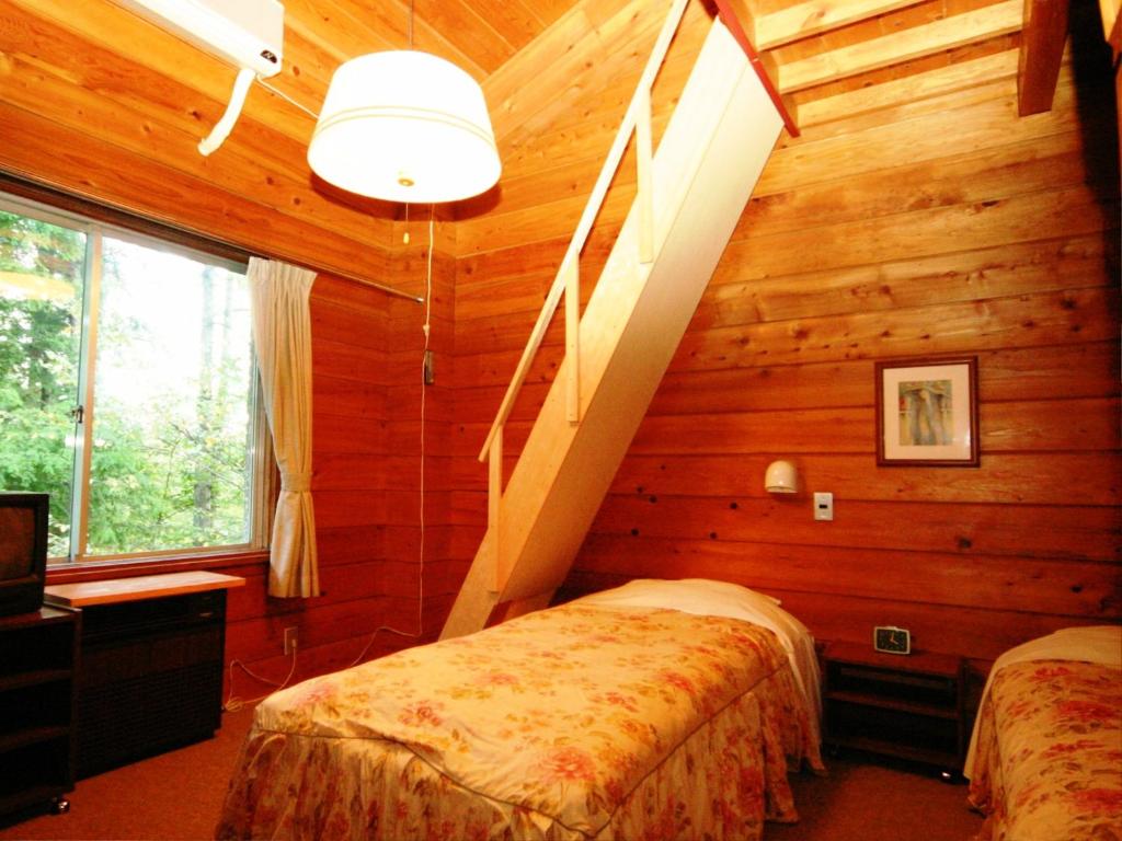 Postel nebo postele na pokoji v ubytování Ullr