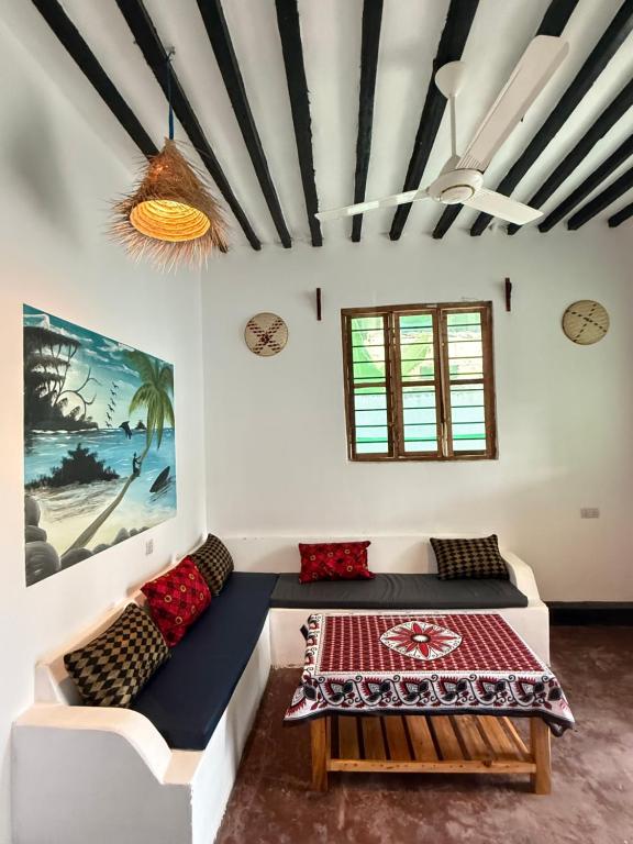 Ένα ή περισσότερα κρεβάτια σε δωμάτιο στο Zanzi coconut house