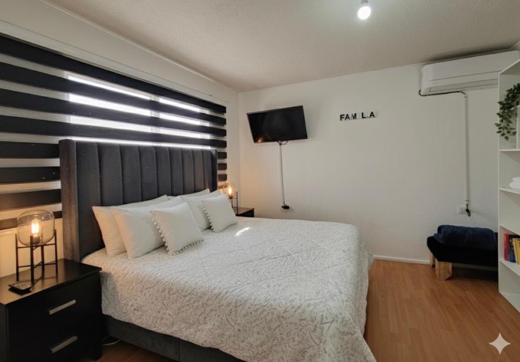 Ένα ή περισσότερα κρεβάτια σε δωμάτιο στο Habitaciones en Curico