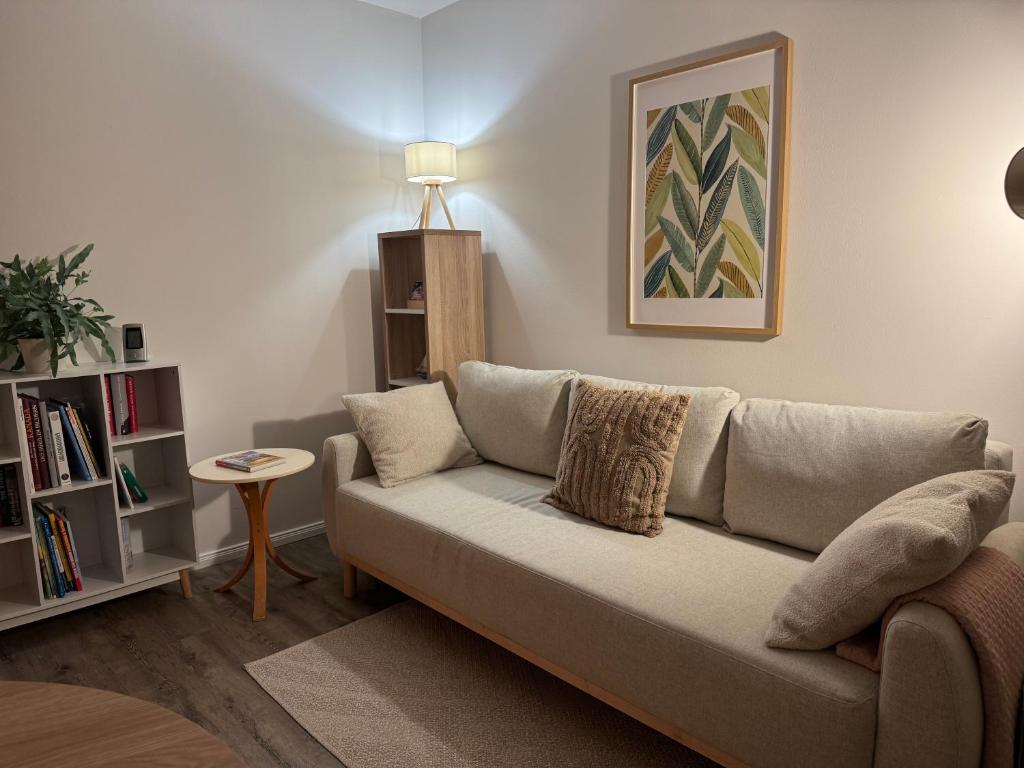 a living room with a couch and a table at Nest,Ruhe und Erholung in Castrop-Rauxel