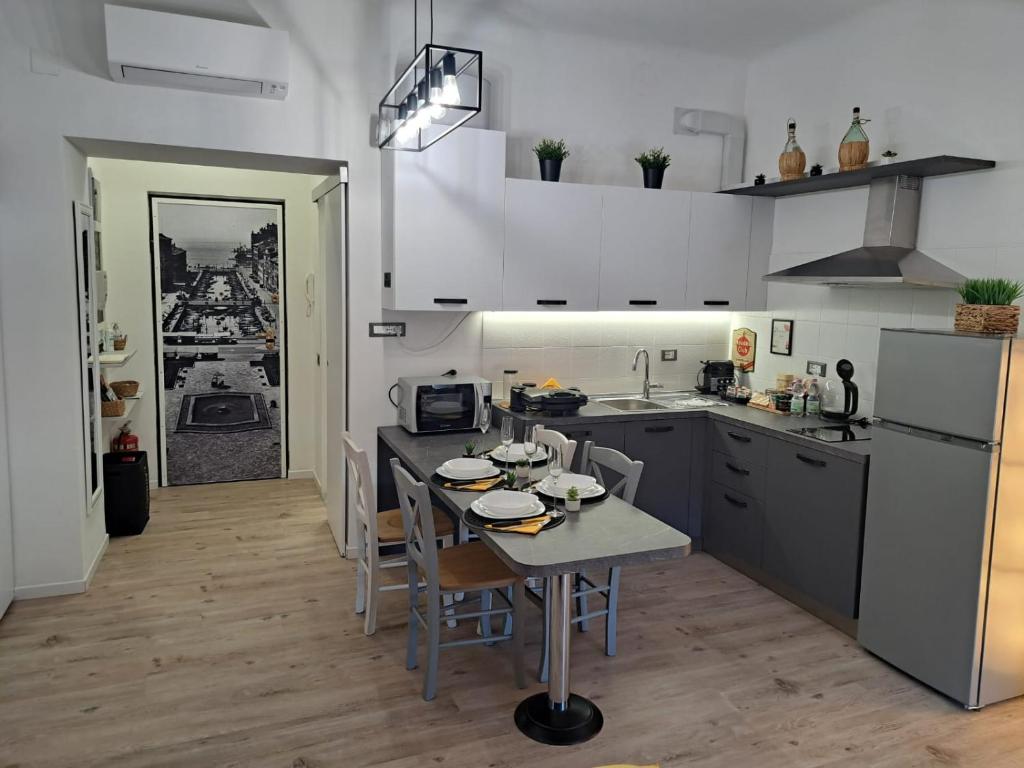 a kitchen with a table and a dining room at The way to trieste bikes storage in Trieste