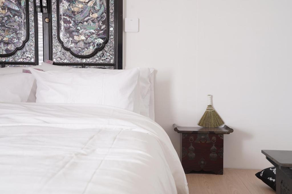 Ένα ή περισσότερα κρεβάτια σε δωμάτιο στο stay105행궁