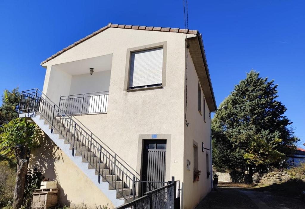 a house with stairs on the side of it at El Solano-La Gallega in La Gallega