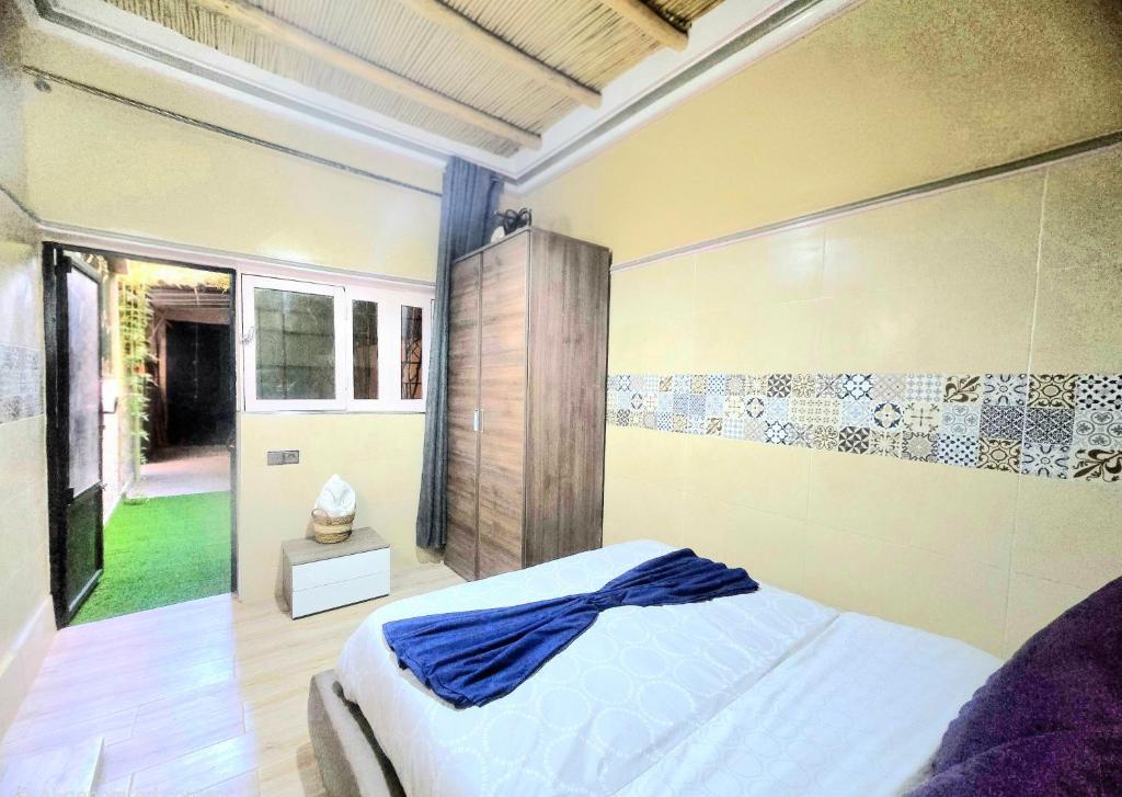 Кровать или кровати в номере 1-Bedroom Apartment with Garden & Wi-Fi in Taroudant City