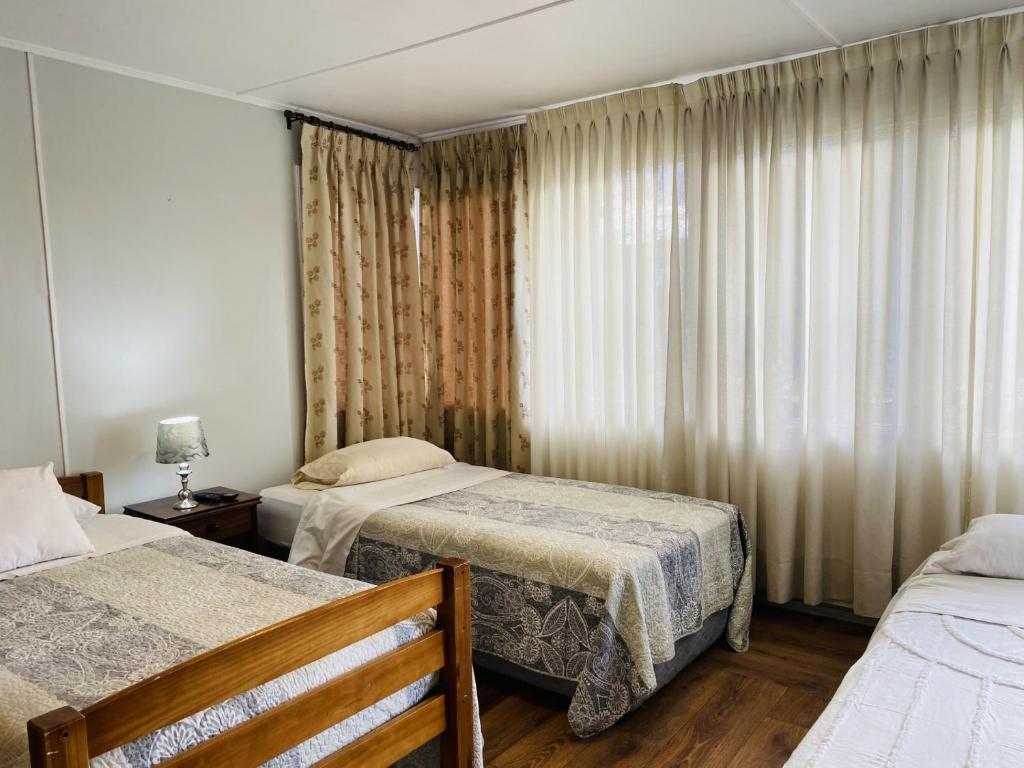 Postel nebo postele na pokoji v ubytování Gran Via Hostel