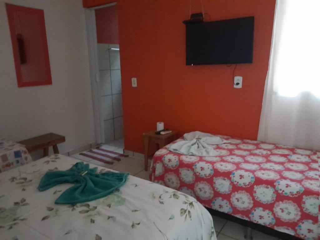 Postel nebo postele na pokoji v ubytování Pousada Guanabra Cuiaba