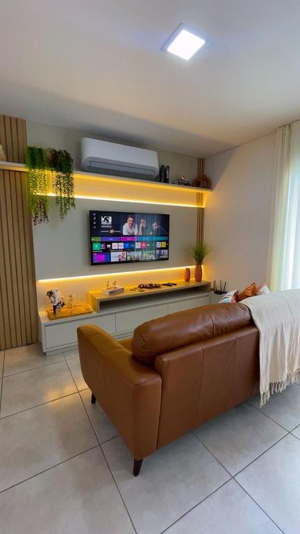 Μια τηλεόραση ή/και κέντρο ψυχαγωγίας στο Apartamento Modernizado