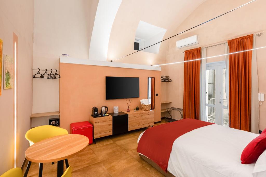 En eller flere senge i et værelse på VICO 58 Rooms