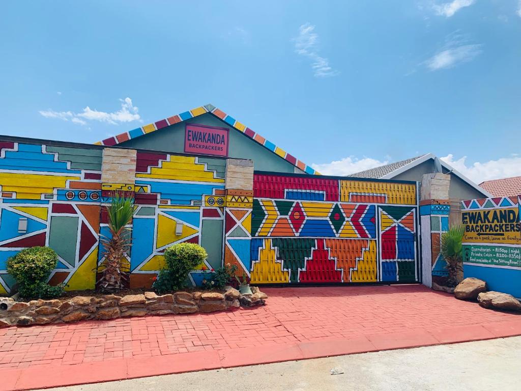 a building with a mural on the side of it at Ewakanda Backpackers in Vereeniging