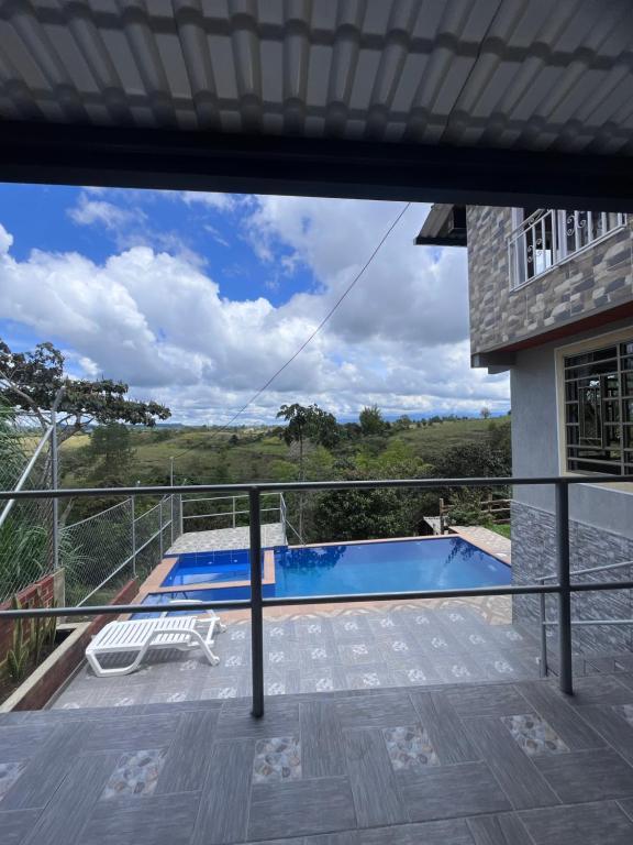 a view from the balcony of a house with a swimming pool at Villa Verde in Popayan
