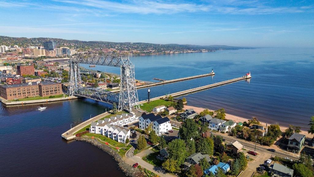 an aerial view of a bridge over a body of water at Dragestil 713 Duluth Luxury Condos by Heirloom Boutique Collection in Duluth