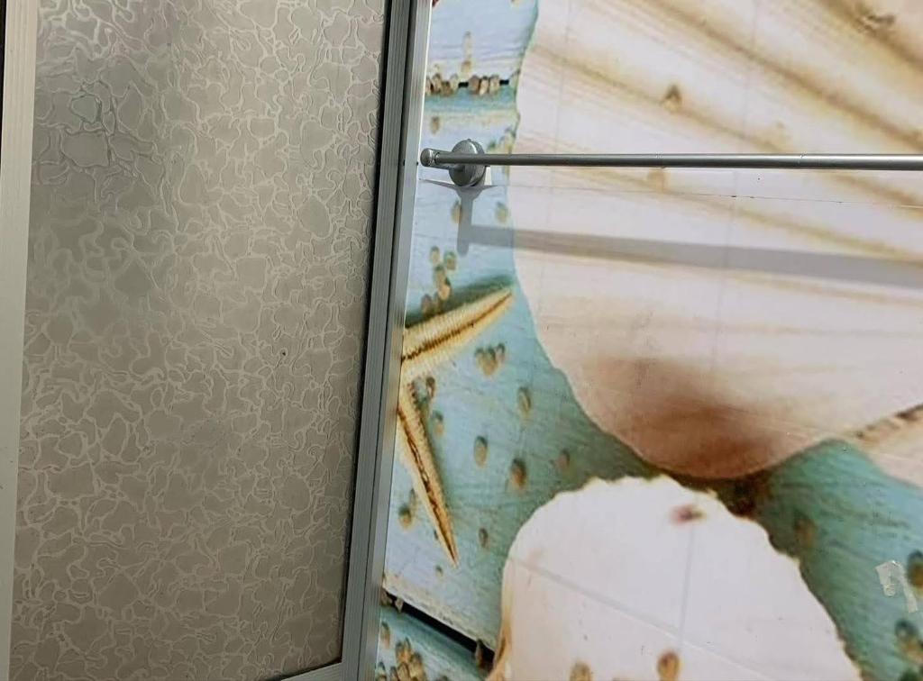 a door with a painting of a boat at Casa do Lago Salinópolis in Salinópolis