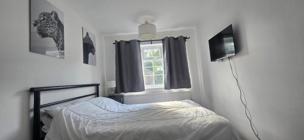 Ένα ή περισσότερα κρεβάτια σε δωμάτιο στο Short & Sweet