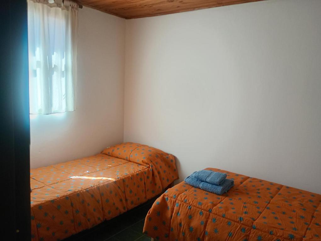 En eller flere senge i et værelse på Casa Piramides