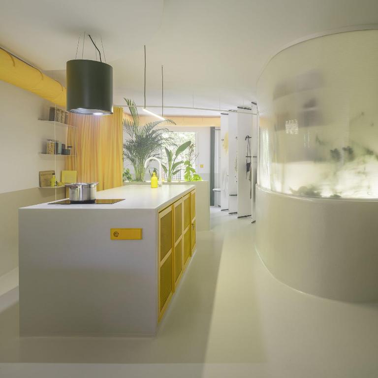 a kitchen with a white counter and a refrigerator at Corrigan Estudio in Pinto
