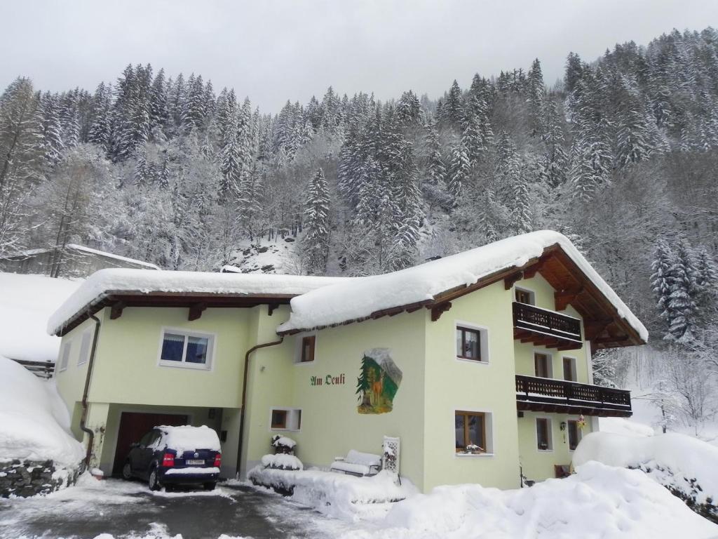 a building with snow on top of it at Haus Deule in Sankt Gallenkirch