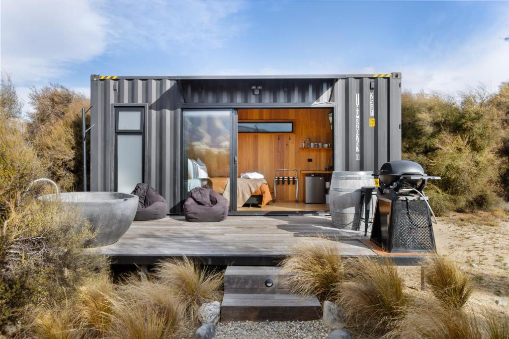 a tiny house in the middle of the desert at Luxury Container and Cabin with Outdoor Bath in Wanaka