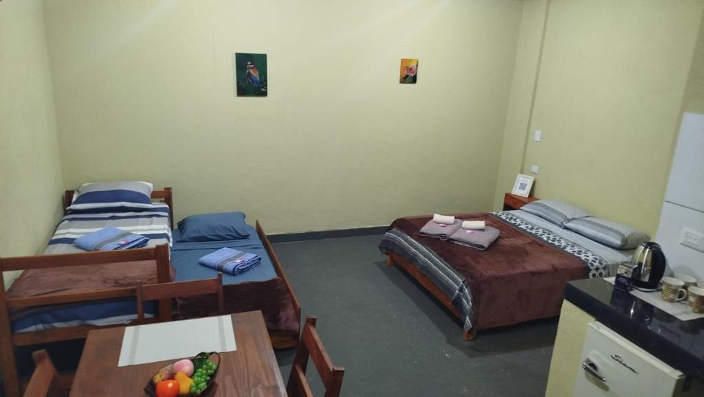 Postel nebo postele na pokoji v ubytování Departamento Monoambiente-Selva Stay Iguazu