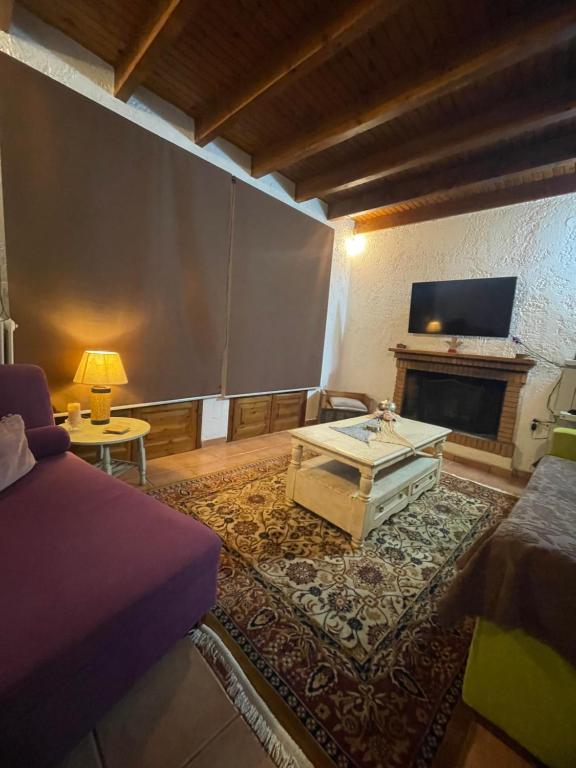 a living room with a couch and a coffee table at Gerali house in Fáros