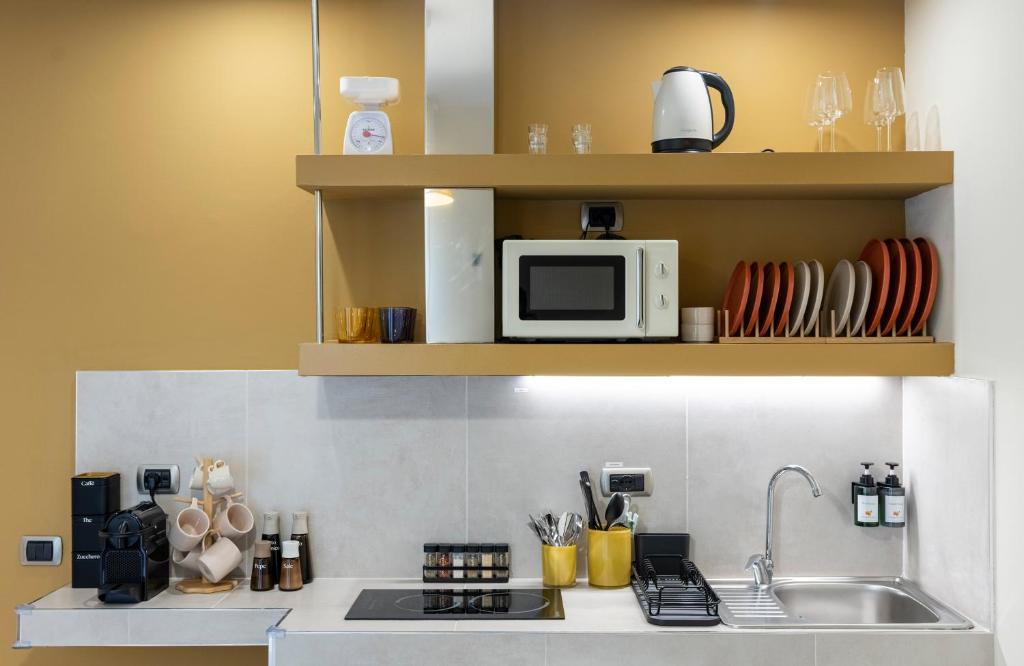 Η κουζίνα ή μικρή κουζίνα στο Bergamo Luxury apartment - Orange Blossom