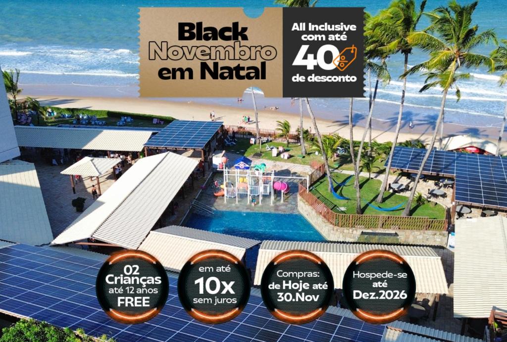 a view of a resort with a pool and a beach at GoldMen Vila do Mar Natal in Natal