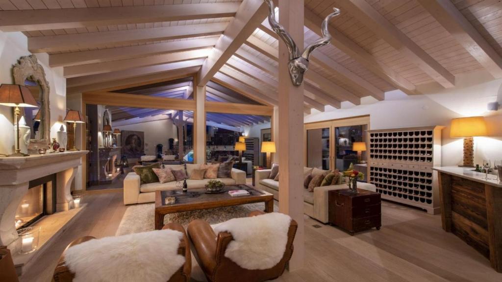 a living room with a couch and a fireplace at Entrebin PremiumChalet AO in Aosta