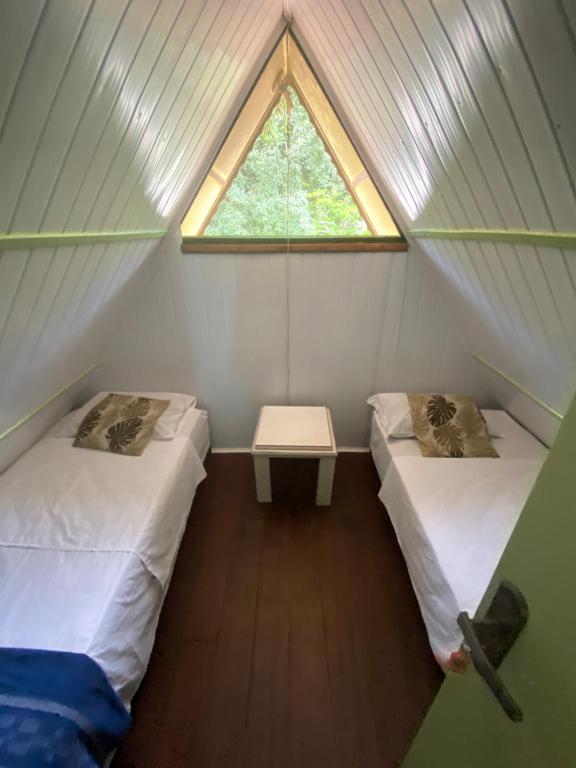 Postel nebo postele na pokoji v ubytování Chale Hostel Do Indio