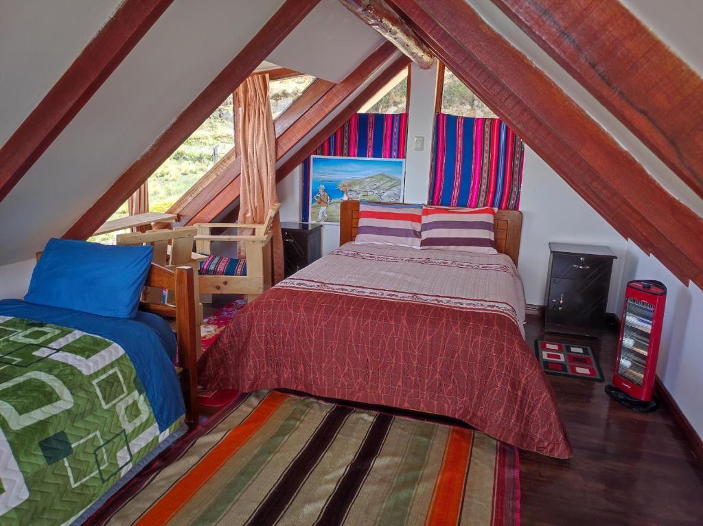 Postel nebo postele na pokoji v ubytování Ecolodge Aymara