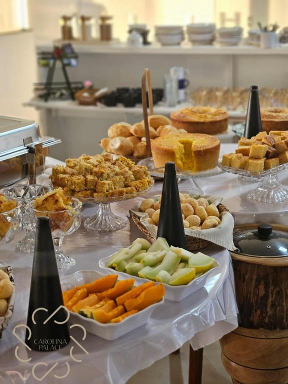 a buffet with many different types of food on a table at Carolina Palace HOTEL in Carolina