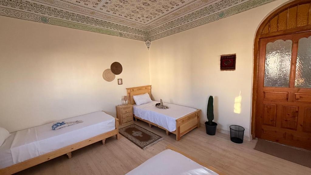 Postel nebo postele na pokoji v ubytování Tidmi Wave Anza