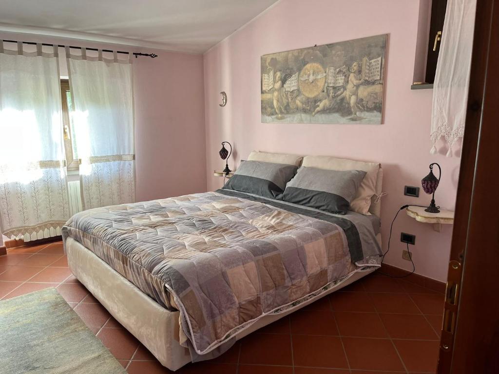 Una cama o camas en una habitación de Le Valli di Piero