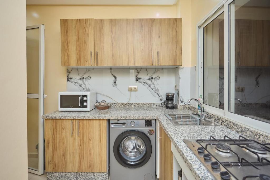 Η κουζίνα ή μικρή κουζίνα στο Appartement l'aéroport