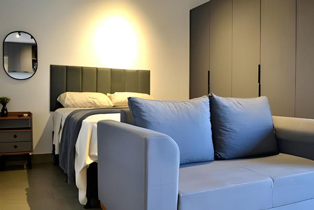 Ένα ή περισσότερα κρεβάτια σε δωμάτιο στο Natureza Viva- Id Vida Urbana