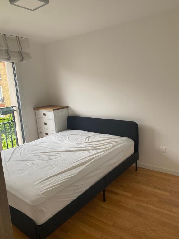 En eller flere senge i et værelse på Carré Haussmann avec parking