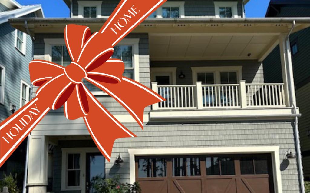a house with a red bow in front of it at Into the Mystic by Seabrook Hospitality in Pacific Beach