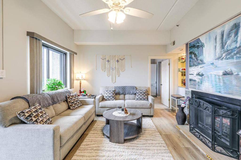 un soggiorno con divano e camino di Majestic Mtn Views, Heated Pool! Sugartop Condo a Sugar Mountain