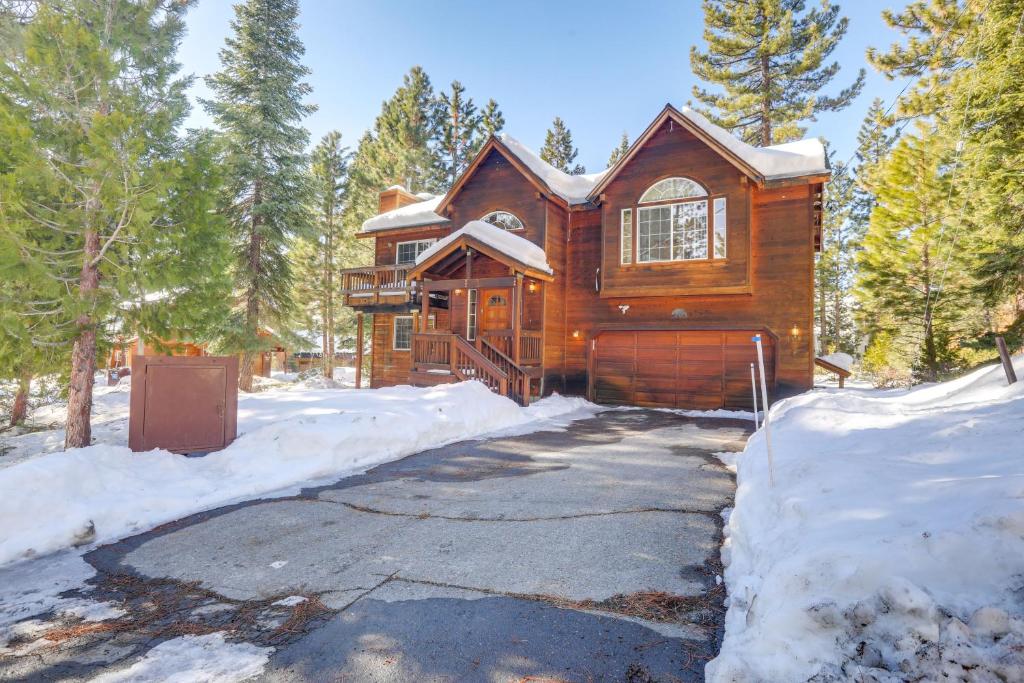 a log cabin in the snow with a driveway at 7 Mi to Northstar Resort Tahoe Vista Family Cabin in Tahoe Vista