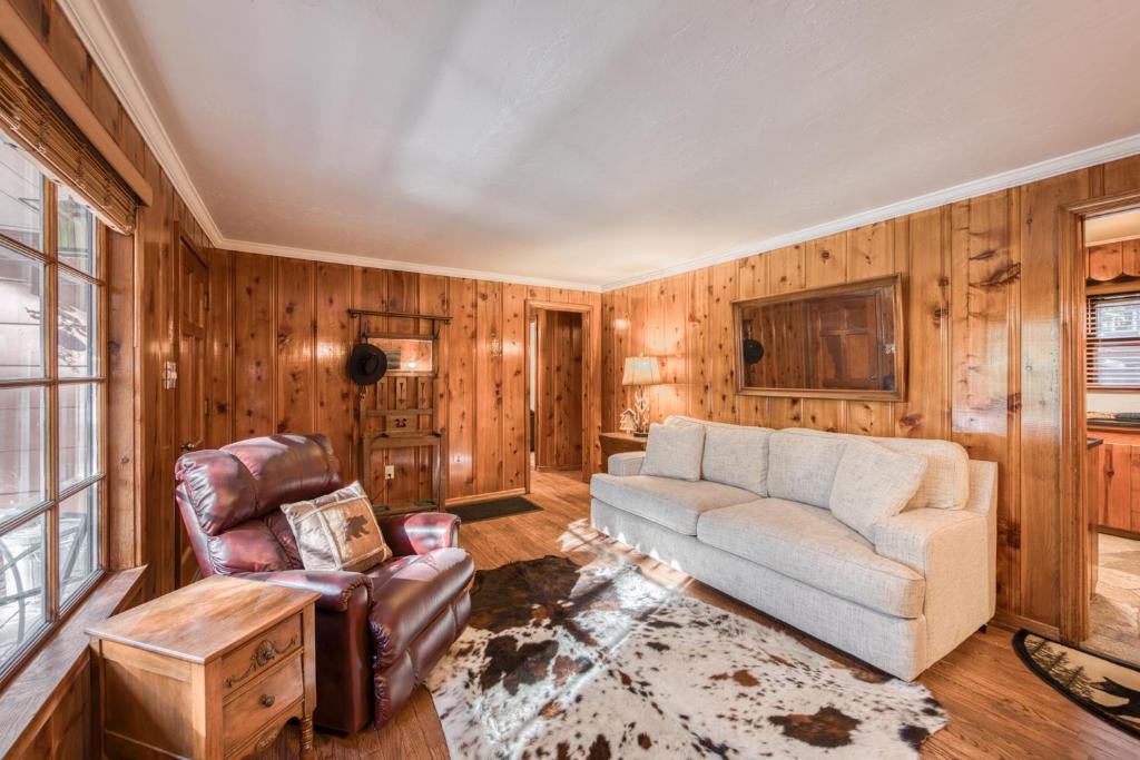 a living room with a couch and a chair at Diana's Cabin by Tahoe Getaways - Pet-Friendly 2BR in Kings Beach w Backyard & Walk to Lake! in Wood Vista