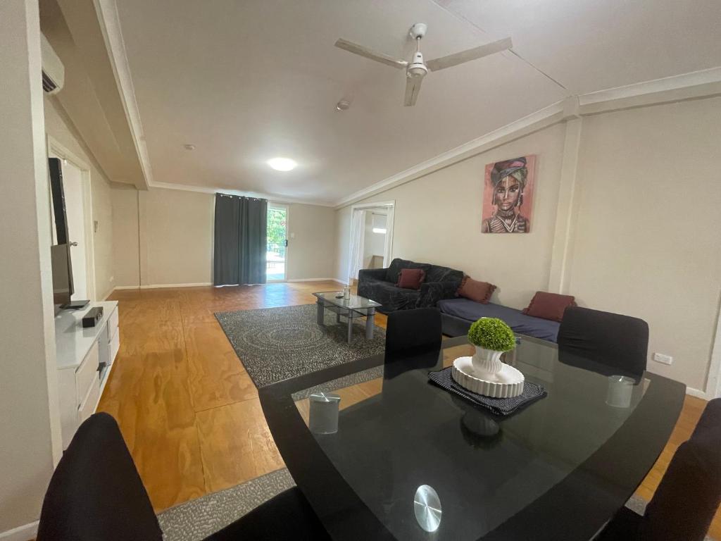a living room with a table and a couch at Cloncurry Caravan Park Oasis in Cloncurry